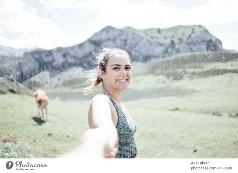 Woman hiking in mountains and looking at the scenic view and magic lands, traveling walking, healthy lifestyle, copy space enjoyment freedom horizontal person