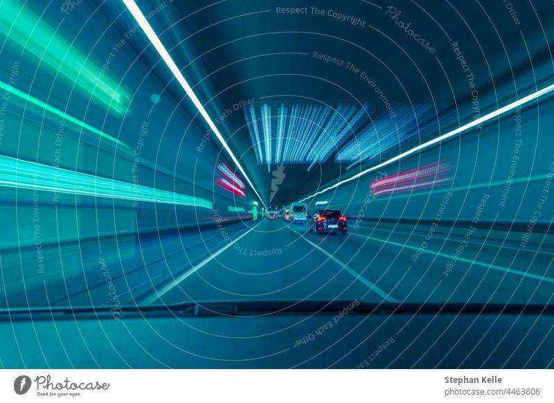 Highspeed drive through a underground tunnel from the car drivers view. almost technology way road concept movement color automobiles transportation line