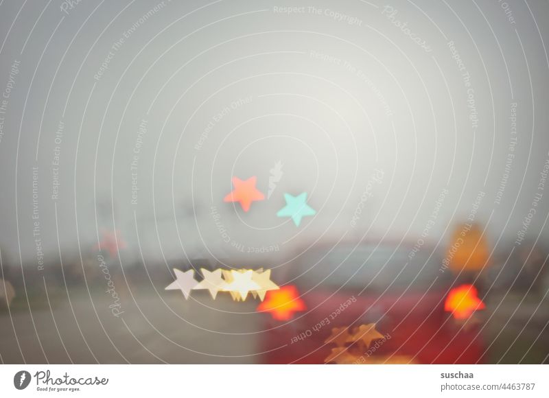 blurred photo with car at traffic light and star bokeh Starry Bokeh Winter Apples somber Gray clearer luminescent Traffic light Traffic lights cross