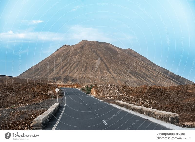 Empty highway and mountain against blue sky road landscape travel trip journey santo antao cape verde cabo verde africa scenery deserted picturesque tranquil