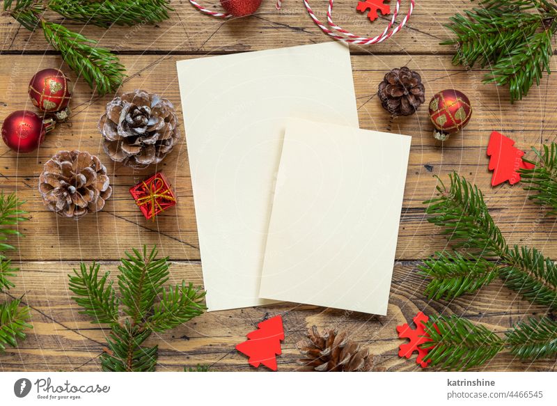 Christmas Composition with a blank cards over wooden table flat lay christmas mockup holiday New year fir template winter paper greeting white decoration