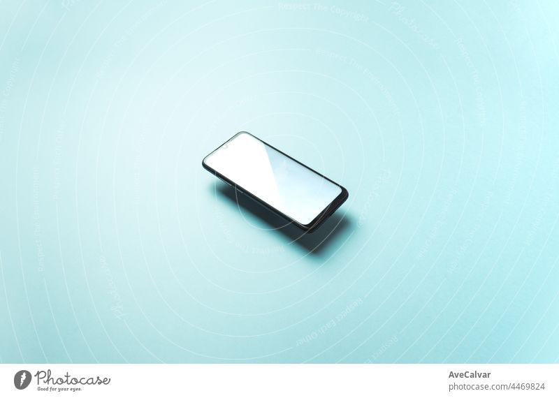 Top view of mobile phone floating blank scree template on pastel pastel blue background with copy space, minimal design, shapes, colorful b colours screen smart