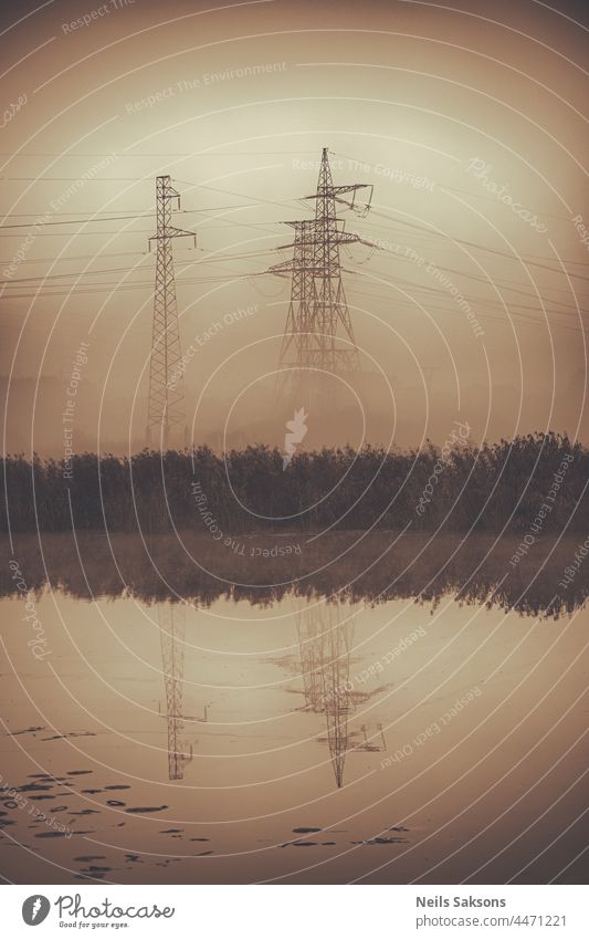 electric lines in the fog, sepia vertical. background be constant be resolute be solitary cable construction distribution electric pole electrical electricity