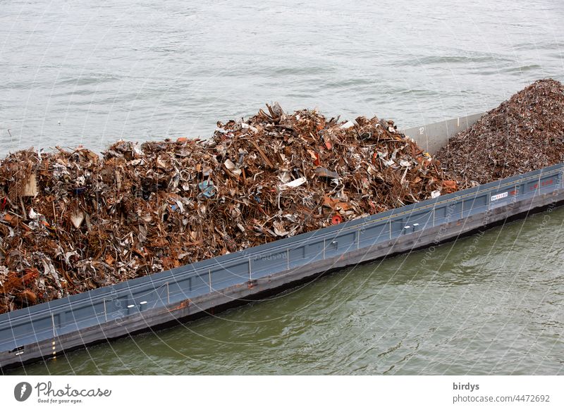 An inland vessel loaded with scrap and scrap metal Scrap metal Metal recycling resource Recycling ship Cargo Navigation Transport Logistics Water