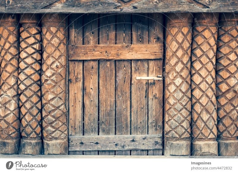 Old wooden door. Close up of old door. Log house exterior wall, wooden house. Close up. Background. Texture. Ancient Architecture background backgrounds Brown