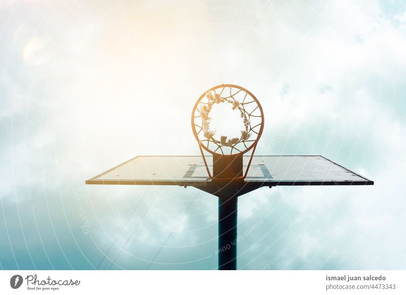 street basket in the city hoop basketball sky blue silhouette circle net sport sports equipment play playing playful old park playground outdoors minimal bilbao