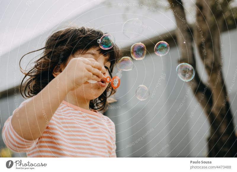 Child playing with soap bubbles Girl 1 - 3 years Caucasian Playing Soap bubble Happiness Colour photo Infancy Exterior shot Human being Joy Day Happy having fun