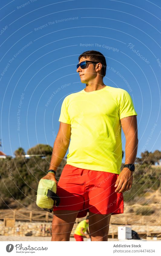 Lifeguard observing sea on sandy beach - a Royalty Free Stock Photo from  Photocase