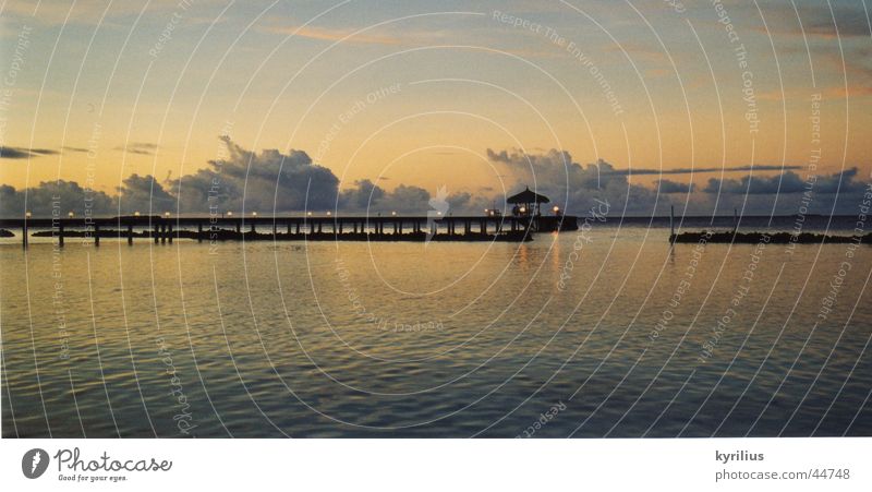 Calm before the storm Ocean Clouds Sunset Footbridge Maldives Umbrella Water