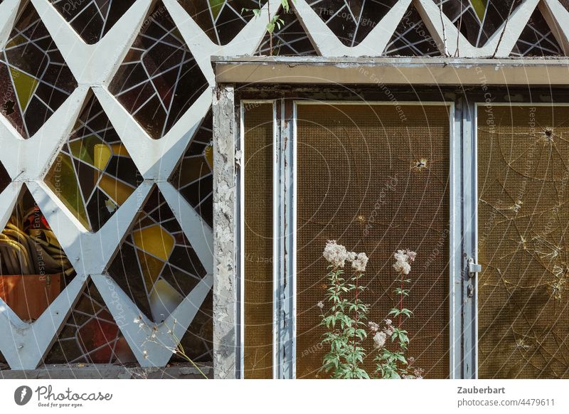 Entrance door and facade with stained glass, architecture of the 60s, dilapidated, Front door Stained glass Facade '60s Architecture Derelict Pattern