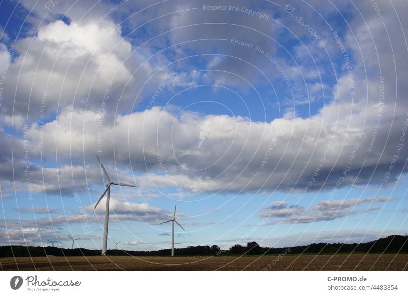 Landscape with wind turbines and clouds in the sky Wind turbines Windmill wind power Renewable Sky Clouds Clouds in the sky Electricity Wind energy plant Energy