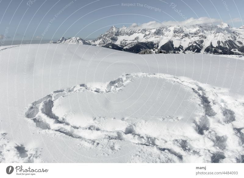 Love affirmation in winter, stepped in the snow. Mountain world in the background Infatuation Romance romantic Heart Heart-shaped tracks in the snow Ski tour