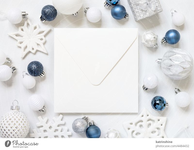 Blank square envelope with Christmas decorations top view, Mockup christmas mockup present blue silver New year white bauble paper ornament winter holiday tag