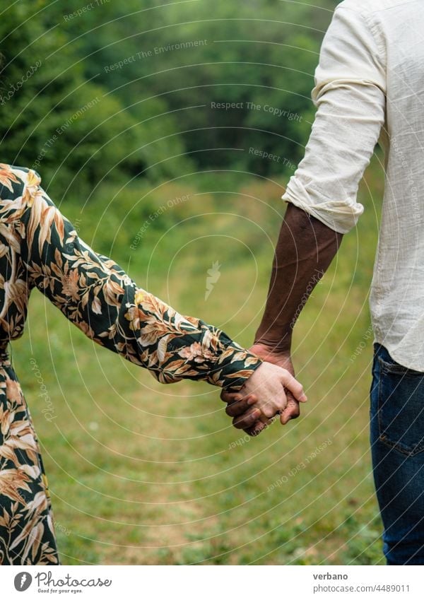 people of different cultures holding hands