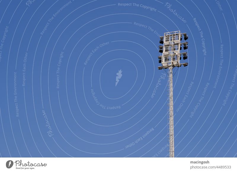 Floodlight mast in front of blue sky Albania Tirana sports stadium floodlight mast Sports Stadium Exterior shot Sporting Complex Football pitch Sporting event