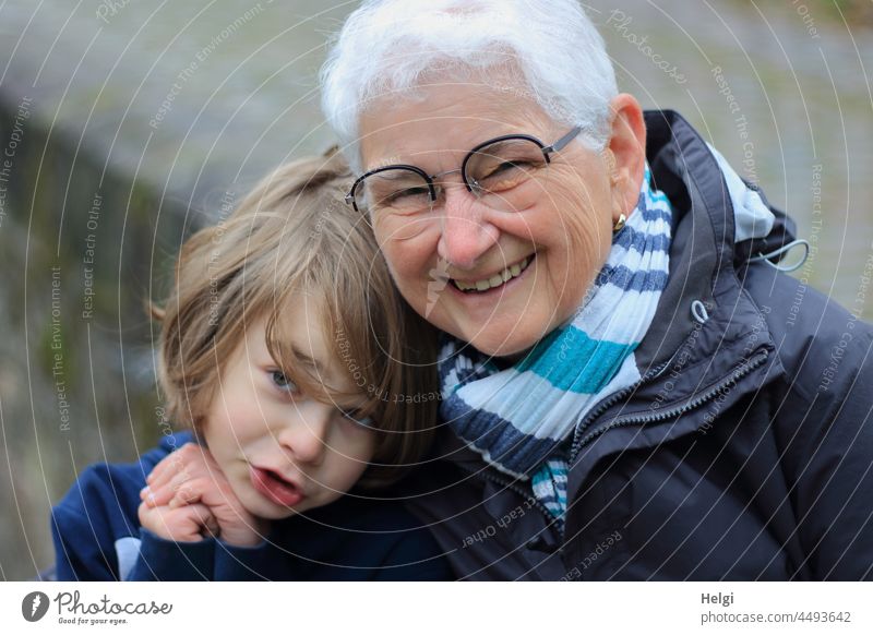 happy granny with grandson in front of old city walls Human being Senior citizen Child grandma Grandmother Grandchildren Generations Old youthful portrait