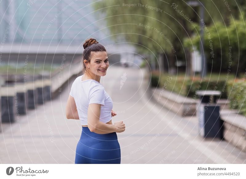 Sporty Female Youth Jogging And Working Out In The Open Air