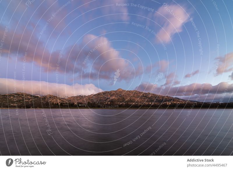 Rippling sea against steep mountain water rock nature coast waterside evening sunset shore environment scenic aqua flow river waterfront slope ridge ripple