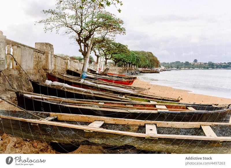 Wooden boat on the sandy shore - a Royalty Free Stock Photo from