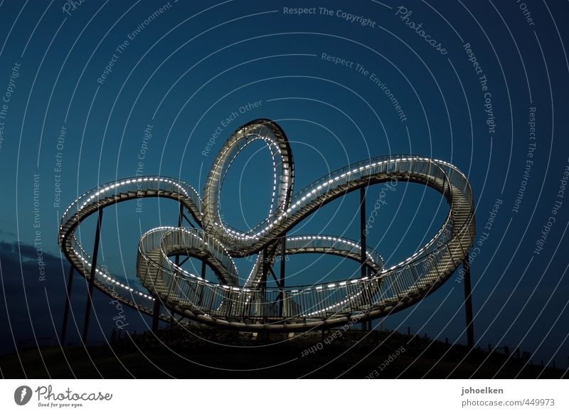 Air snake made of steel and light Tourism Trip Industrial heritage Work of art Sculpture Slagheap Duisburg The Ruhr Deserted Roller coaster Stairs