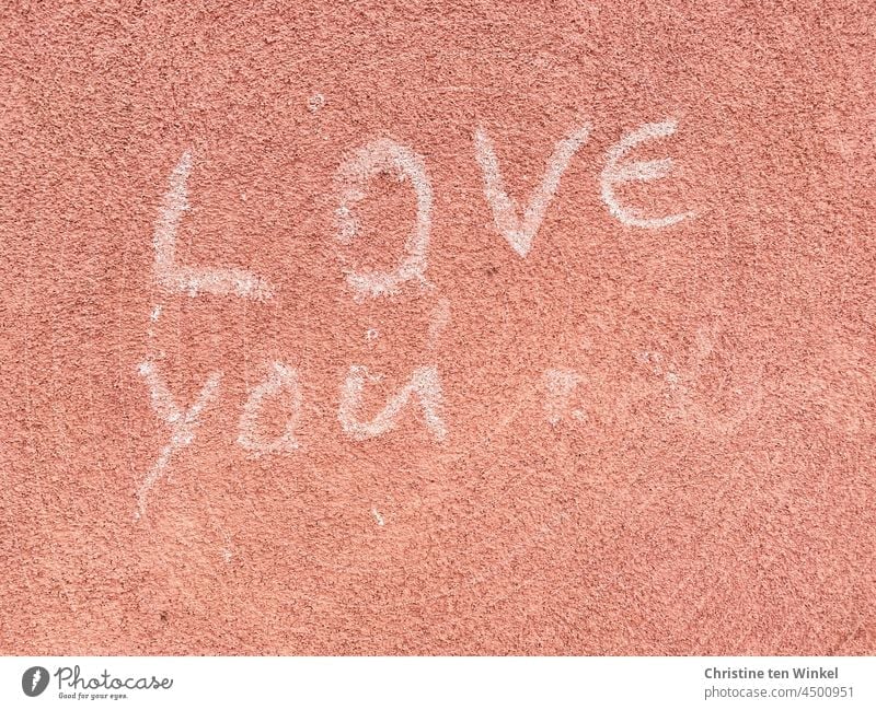 ' LOVE you ' is written in white letters on a pink plastered wall Love you Declaration of love With love Infatuation Emotions Display of affection Romance