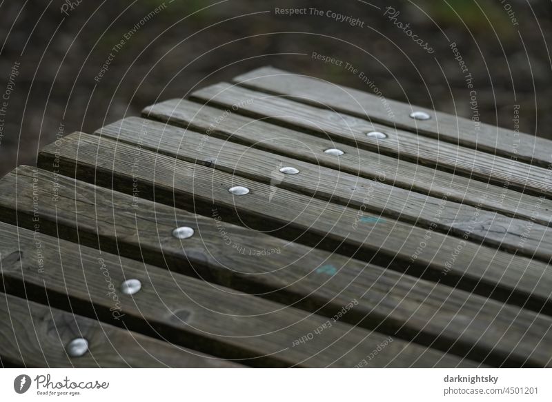 Bench made of wooden slats with stable bolting, element of a seat on a hiking tour to take a rest. detail Wood carpentry Detail Colour photo Deserted