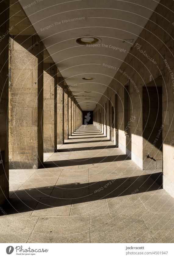 Light meets shadow in the aisle Architecture Structures and shapes Historic Long Sunlight Symmetry Silhouette Airport Berlin-Tempelhof Abstract Shadow play