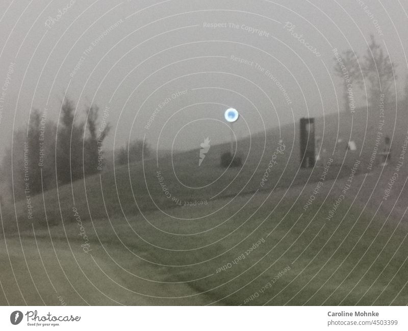 A luminous clock defies a foggy morning on a golf course Fog Clock Gloomy Deserted Exterior shot Nature Landscape Copy Space top Environment Day Gray