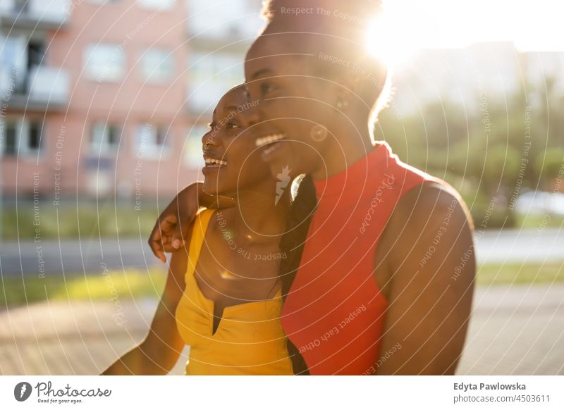 Two girlfriends having fun in the city youth sisterhood attractive real people millennials cool diversity black friendship together girls summer beautiful