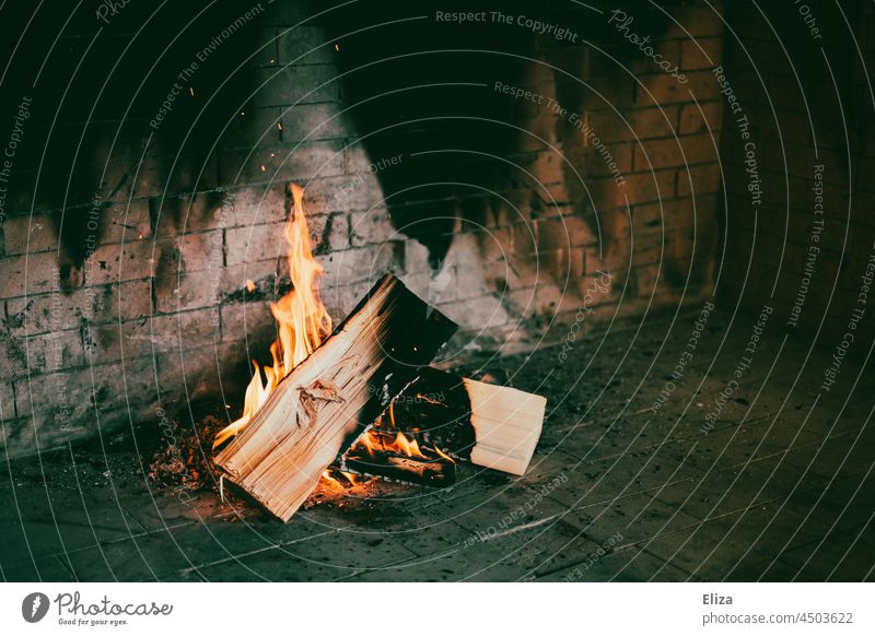 feet warming up on fireplace - a Royalty Free Stock Photo from Photocase