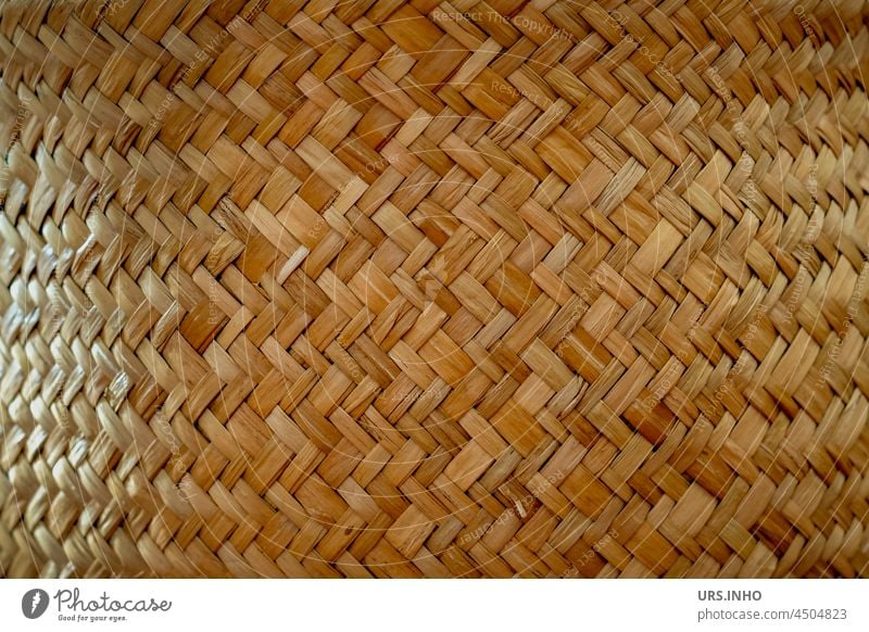 a curved background of woven raffia or simply the detail of a raffia planter Bast Nature Brown Orange Close-up Deserted Detail Plaited Basket naturally Lichen
