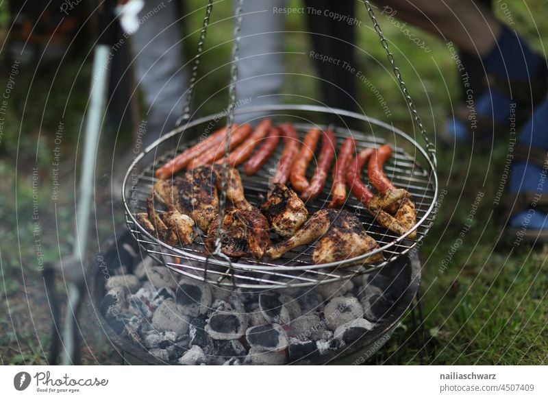 Barbecue. Camping grilled meat mealtime food and drink Glow Heat Gastronomy Cook Outdoors skewers Feet Weekend barbecue Party Meal Frying Flame Fire Cooking