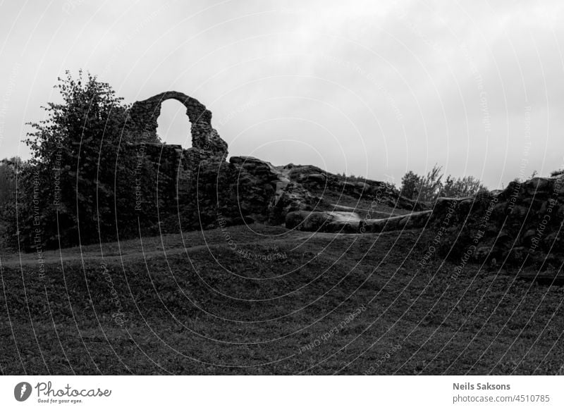 Old Stone Ruins of an Ancient Castle in Rezekne, Latvia. Black and White ancient arch archeology architecture building castle catholic century city cityscape
