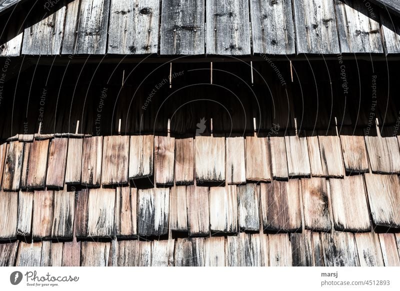 Shingle wall on an alpine hut. Shadow play with the gable. Wall (building) Cladding Patina naturally Weathered Sustainability Protective coating Orderliness