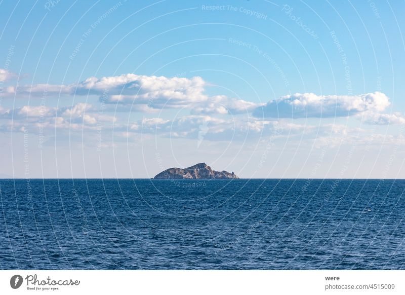 The island of Cerboli in the Mediterranean Sea between the port of Piombino and the island of Elba under a blue sky France Italy Port Spain Tuscany Waves