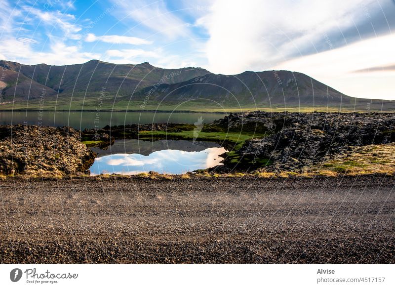 2021_08_10_snaefellsnes reflections between lava fields and mountains 1 water travel lake outdoor view scenic landscape nature rock iceland sky natural grass