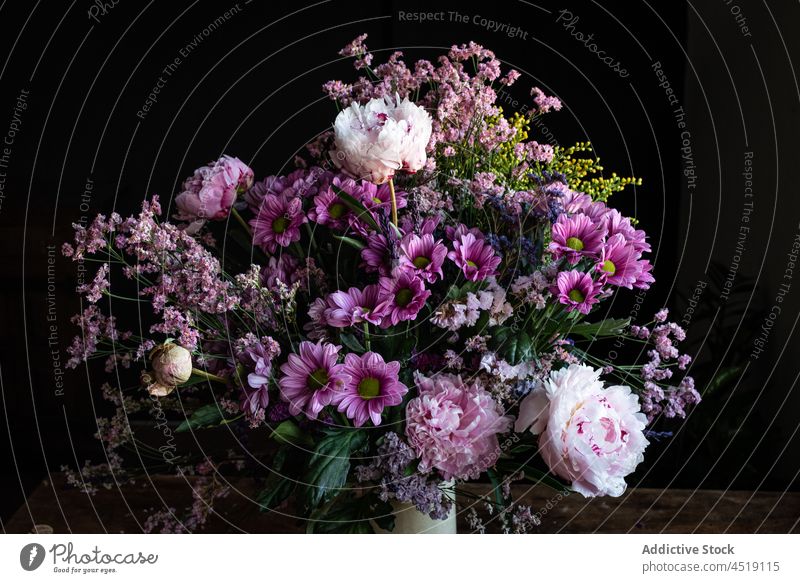 Bouquet of flowers on wooden table bouquet chrysanthemum peony vase weathered floral plant blossom bloom bunch glass colorful botany botanic rustic decorate