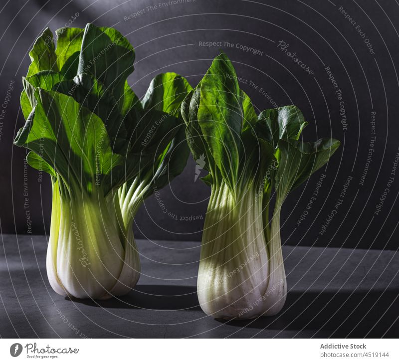Chinese cabbages on black table in studio chinese cabbage vegetable bok choy pak choy food healthy leaf diet two healthy food vitamin fresh plant raw