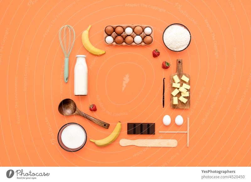 Crepes ingredients and utensils flat lay on an orange table. above aligned arranged background baking banana butter chocolate clean color cooking copy space