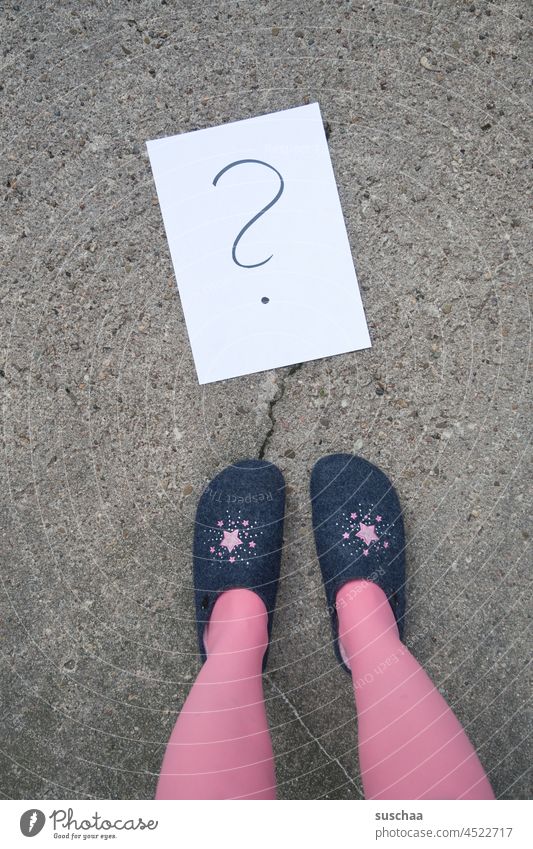 someone is standing in the street with slippers on and does not know what to do next Footwear Slippers Stockings Stand feminine pink Street Asphalt