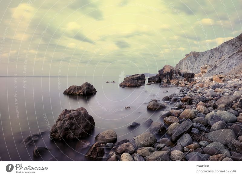 Who threw the first stone...? Landscape Sky Clouds Horizon Summer Weather Beautiful weather Rock Coast Beach Ocean Blue Brown Gray Calm Stony Colour photo