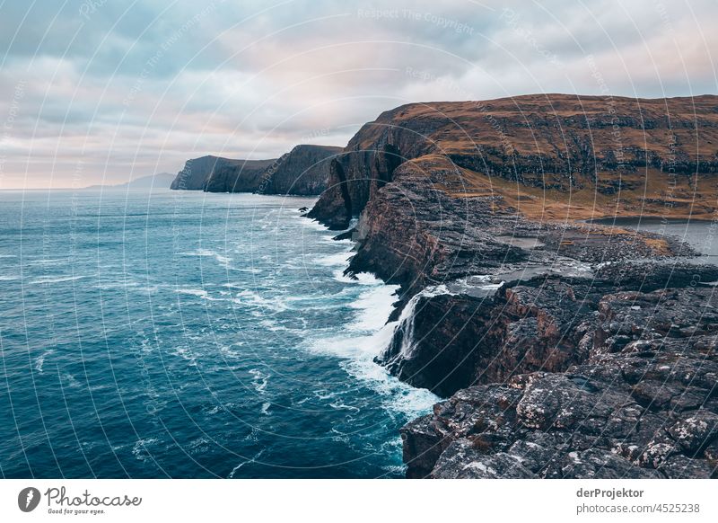 Rocks of Bøsdalafossur with view of the Faroe Islands II Surf curt Slope Territory Sun Dismissive cold season Denmark Experiencing nature Adventure Majestic