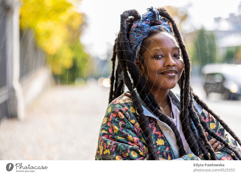 Portrait of confident young woman outdoors unaltered natural real people authentic body inclusivity body positive one person hipster girl hairstyle dreadlocks