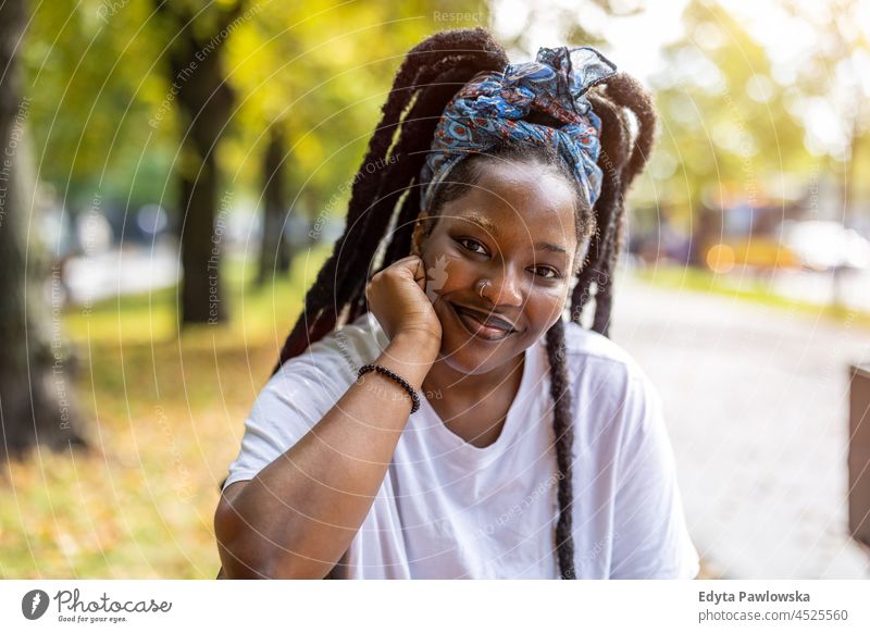 Portrait of beautiful young woman outdoors unaltered natural real people authentic body inclusivity body positive one person hipster girl hairstyle dreadlocks