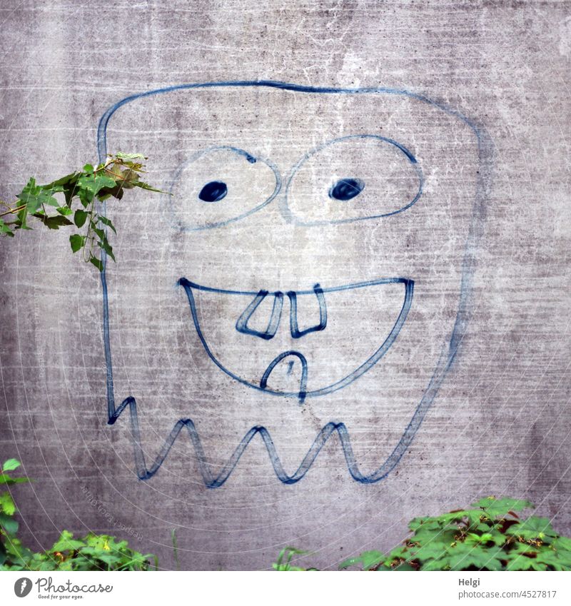keep smiling - painted monster face on a concrete wall Monster Monster Face Concrete Concrete wall Painted Work of art Creativity creatively Funny Plant kind