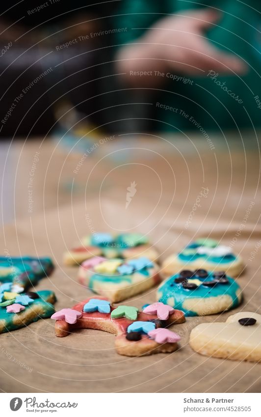 Christmas cookies with icing on baking paper Icing Decoration Cookie Christmas biscuit cut out cookies Baking cute at the same time cookie dough holidays