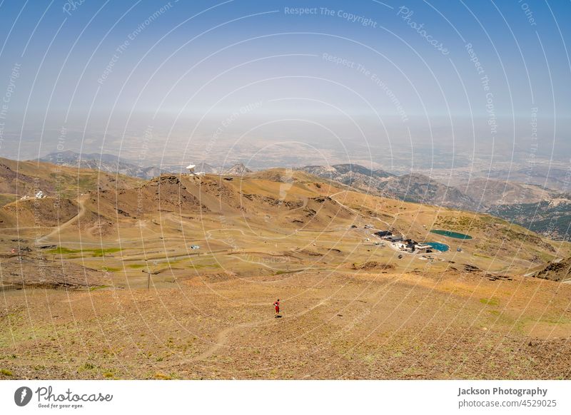 Runner in mountains of Sierra Nevada, Andalusia, Spain sierra nevada run sport runner trail man people person spain landscape national park copy space blue sky