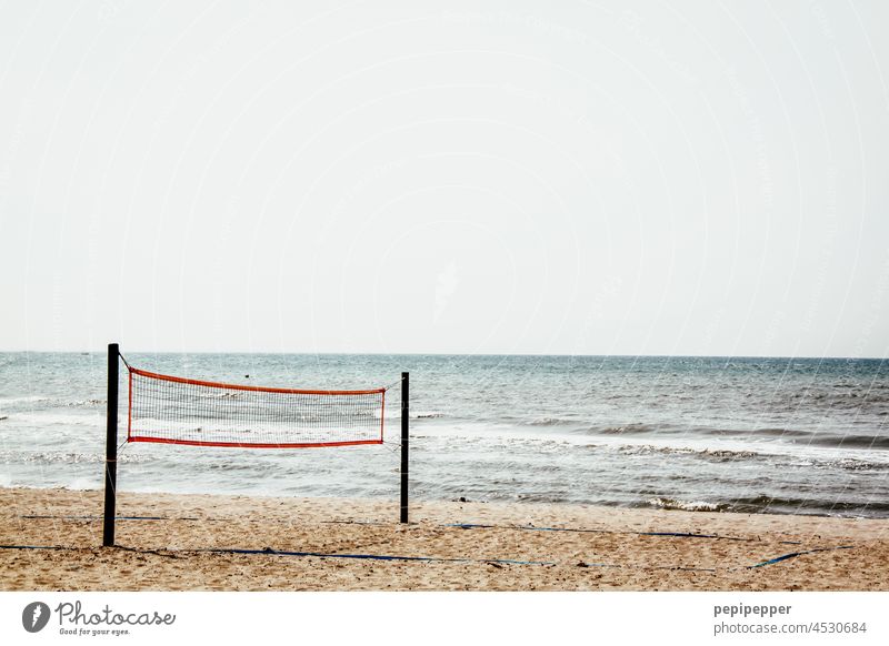 Volleyball net on the beach Beach life Loneliness Lonely Loneliness Silence Ocean Exterior shot coast Vacation & Travel Relaxation Sand Tourism Vacation mood
