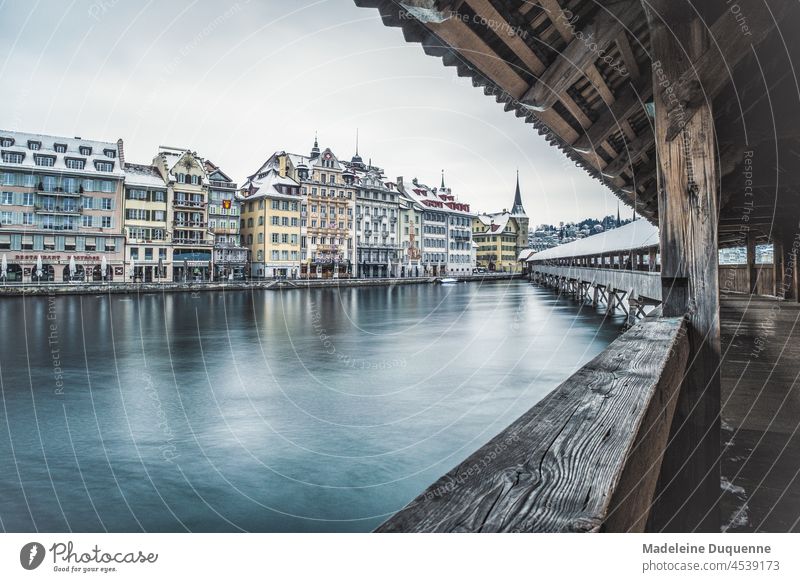 Chapel bridge with the water tower in Lucerne Switzerland Europe Kapellbridge Water tower reuss Winter Snow travel Town Tourism city