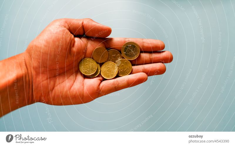 euro coins in hand finance currency money wealth person business cash saving cent concept bank banking change isolated background buy charity finger giving gold